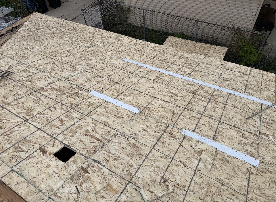 New roof decking with sealed seams ready for underlayment